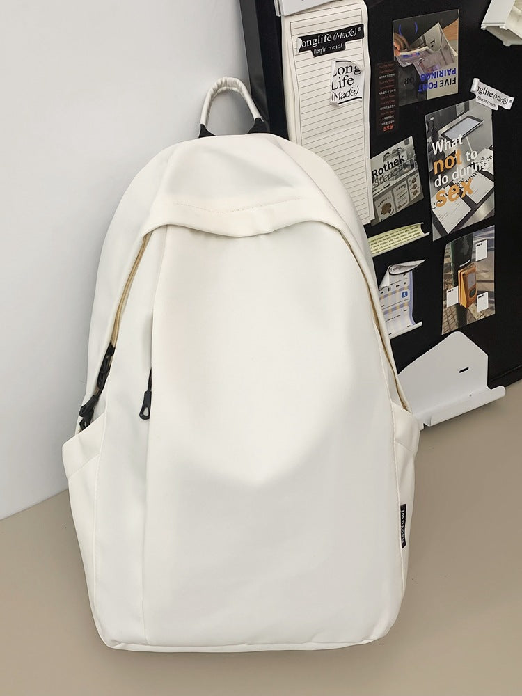 Large capacity school bag male high school student Korean version trendy travel backpack female junior high school student simple solid color backpack