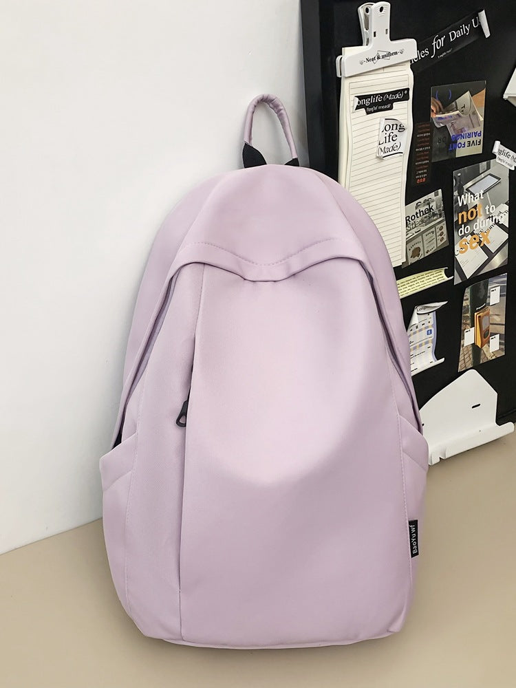 Large capacity school bag male high school student Korean version trendy travel backpack female junior high school student simple solid color backpack