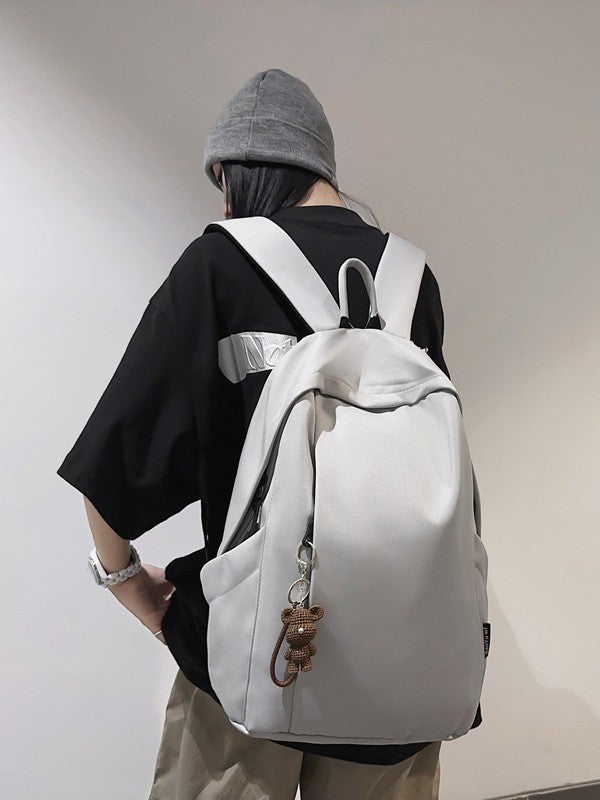 Large capacity school bag male high school student Korean version trendy travel backpack female junior high school student simple solid color backpack