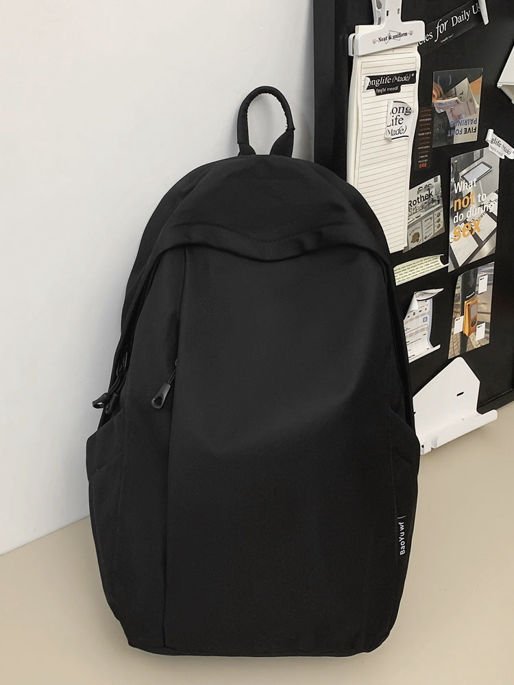 Large capacity school bag male high school student Korean version trendy travel backpack female junior high school student simple solid color backpack